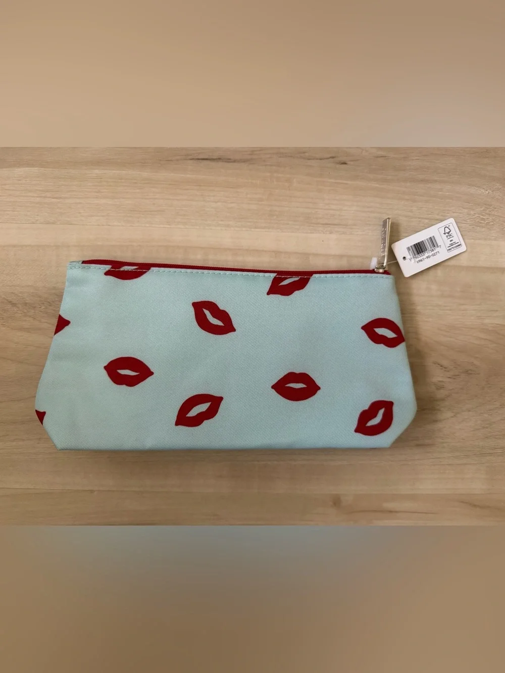 Clinique x kate spade Cosmetic Pouch in Light Blue with Red Lip Print